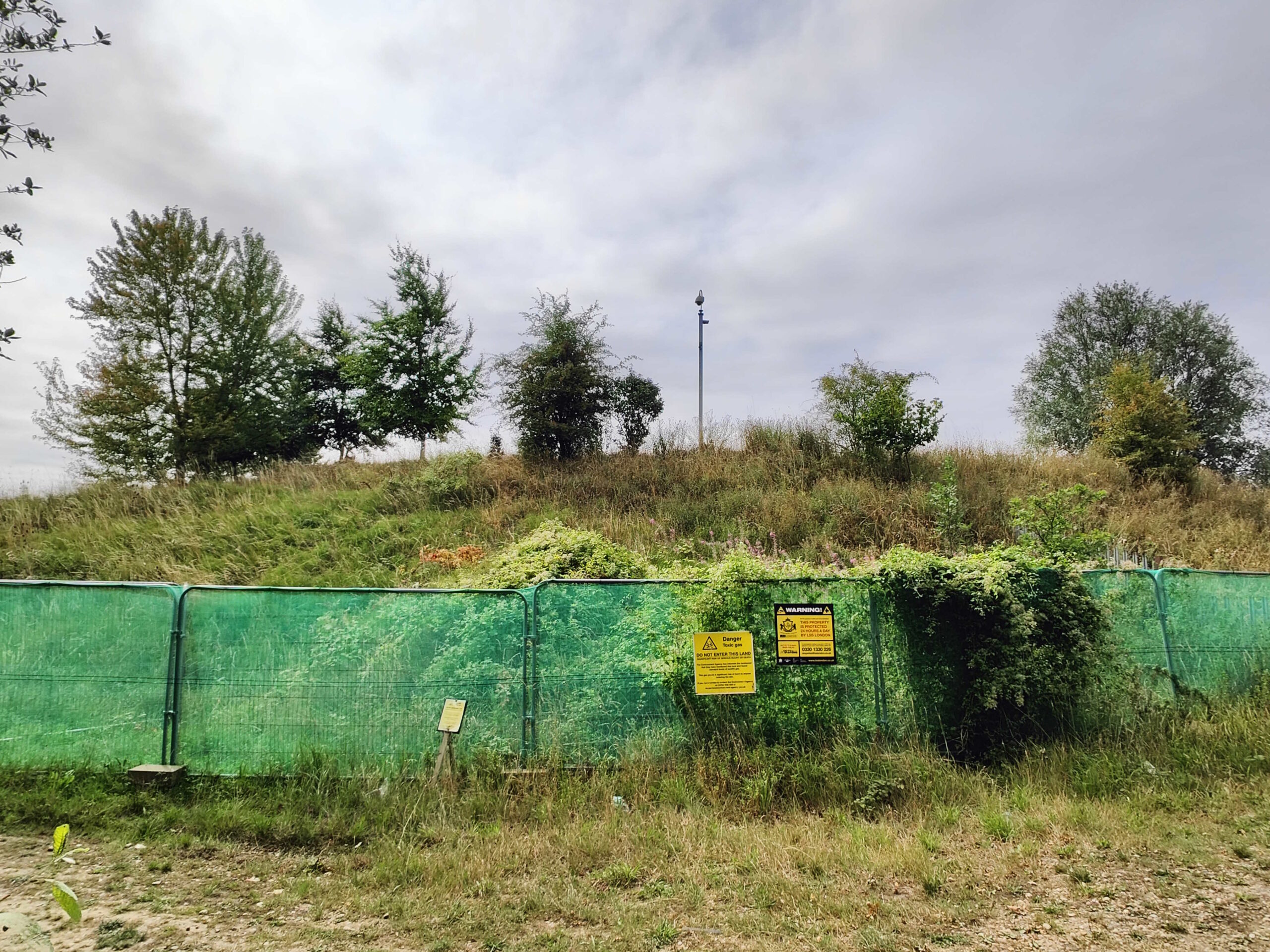 The entrance ti Crumps Farm Dump with a keep out sign